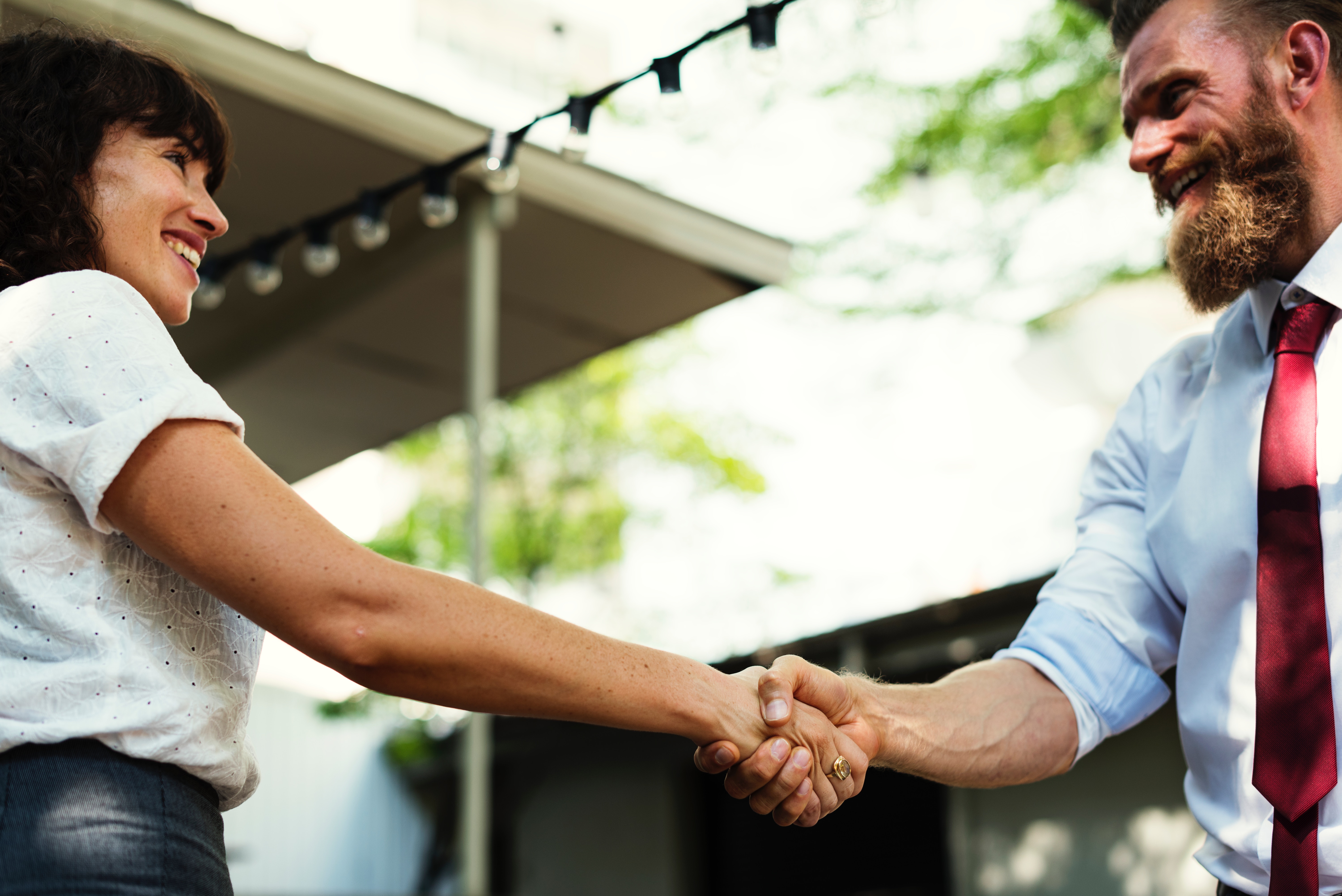 A man and woman greet each other